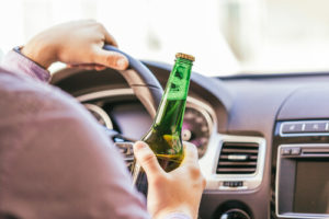 Person drinking and driving