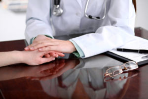 Injured person being comforted by a doctor
