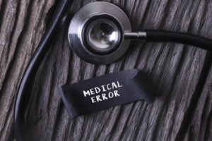 Stethoscope beside medical error label