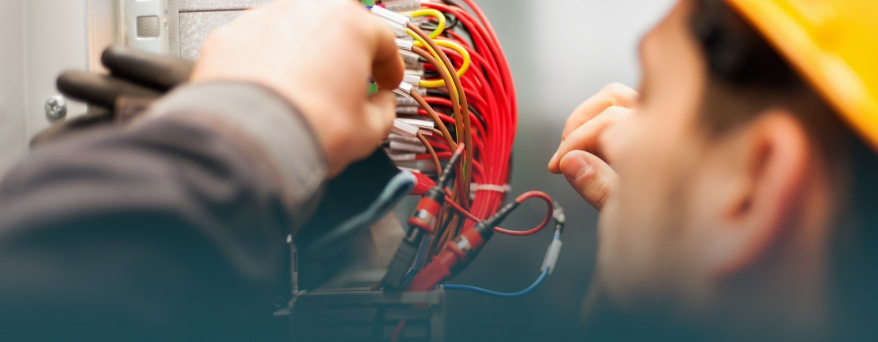 Electrical professional working on connecting cables