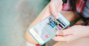 woman hand holding a cellphone