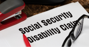 social security disability claims words on a paper with glasses