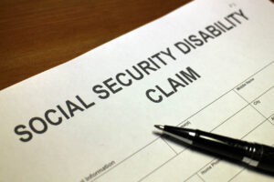 Pen on top of social security disability papers